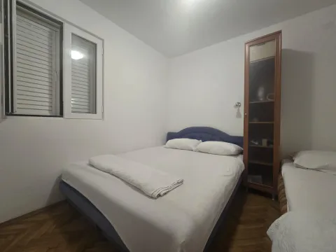Bedroom with a double bed, wardrobe, and a window. - image 6