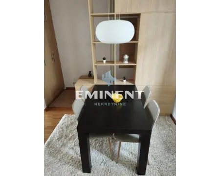 Dining table with chairs as part of the living room. - image 6
