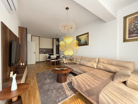 Spacious living room with a sofa set and dining area in the background. - image 2