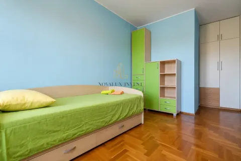 Children's bedroom with a bed, wardrobe, and storage units. - image 9