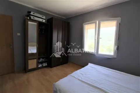 Furnished bedroom with a double bed, wardrobes, and a window. - image 7