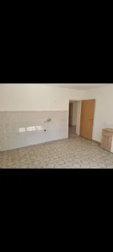 An empty room with tiled floor and wall. - image 18