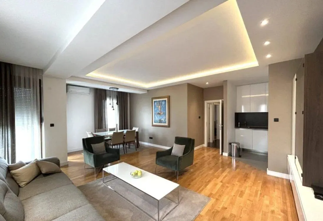 Spacious living room connected with dining area and kitchen.