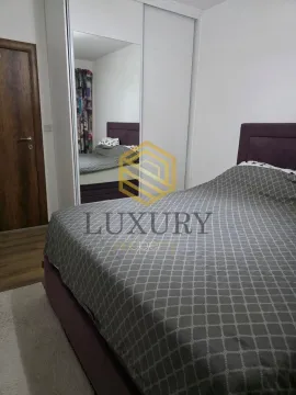 Furnished bedroom with a double bed and a fitted wardrobe. - image 5