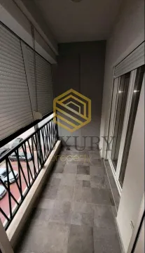 Smaller enclosed balcony with tiled floor and metal railing. - image 4