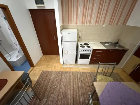 Smaller kitchen with a stove, refrigerator, and sink. - image 4