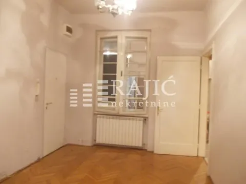 Empty room with parquet flooring and white doors. - image 7
