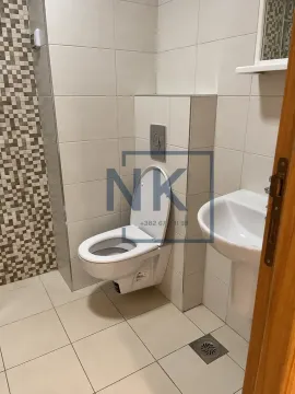 Smaller bathroom with a toilet and a washbasin. - image 6