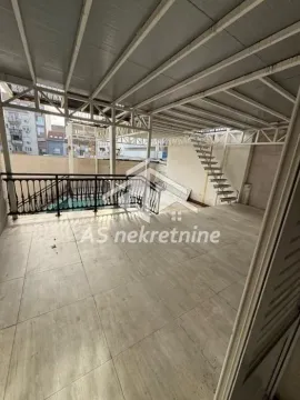 Large covered terrace with a metal structure and stairs. - image 13