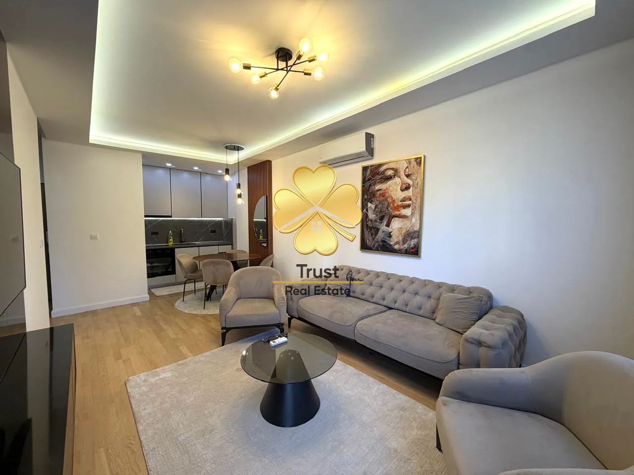 Modern and bright living room connected to the dining area and kitchen.