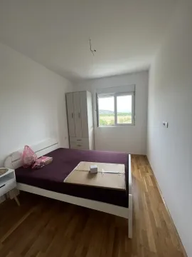 Bright bedroom with a double bed and a wardrobe. - image 8