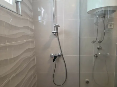 Modernly equipped bathroom with a shower cabin. - image 4