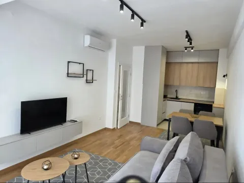 Modern open-plan living room with kitchen and dining area. - image 14