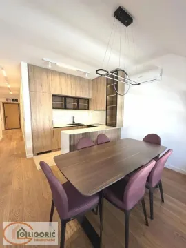 Modern kitchen with dining area and wooden furniture. - image 5