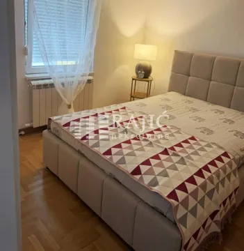 Furnished bedroom with a double bed. - image 8