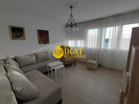 Living room with a sofa set, armchair, and windows with white curtains. - image 13