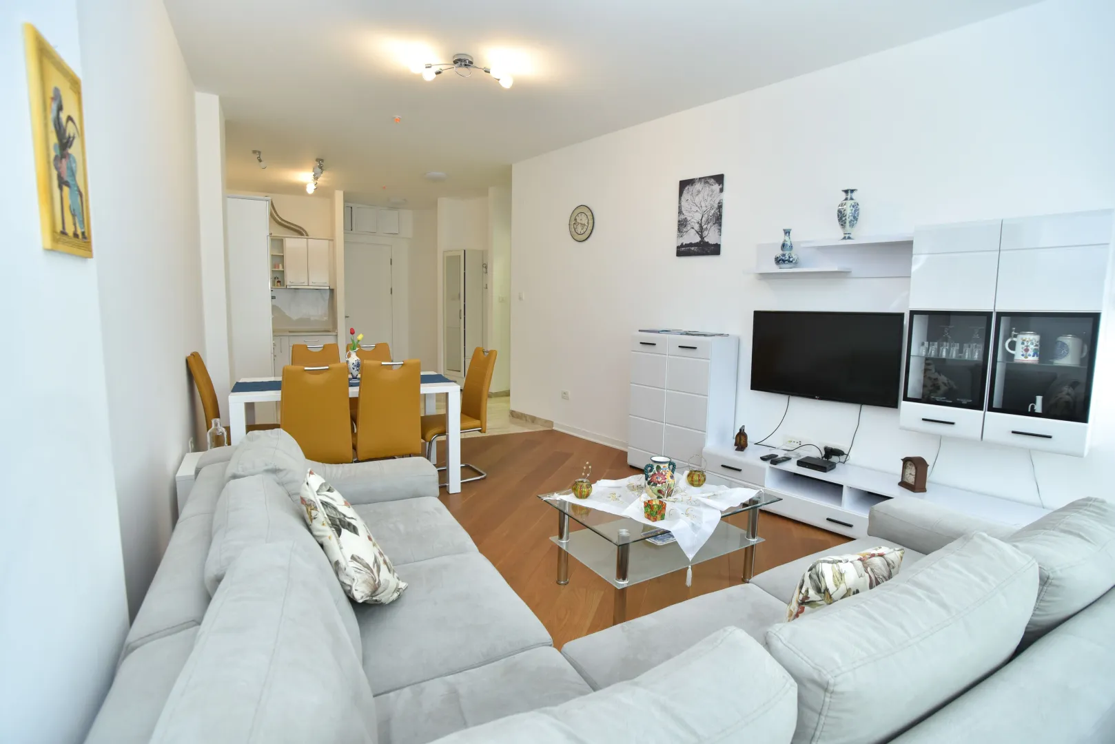Spacious and bright living room connected to the dining area and kitchen.
