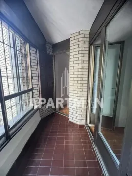 Long and narrow terrace with tiled flooring and large windows. - image 8