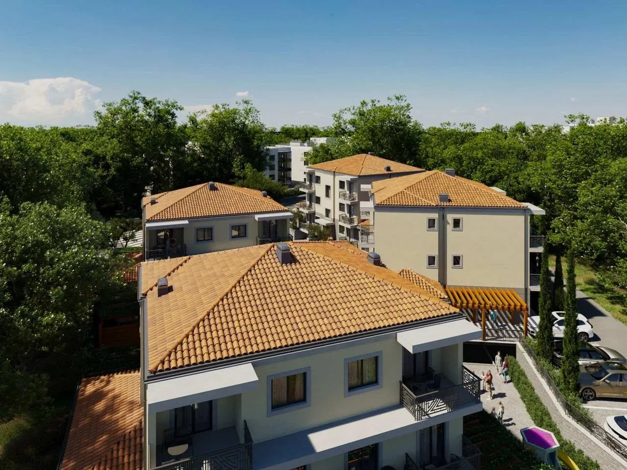 Pogled iz vazduha na moderne stambene zgrade sa uređenim dvorištem.