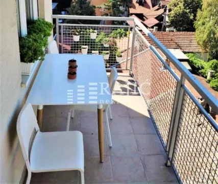 Furnished terrace with a dining table and chairs. - image 7