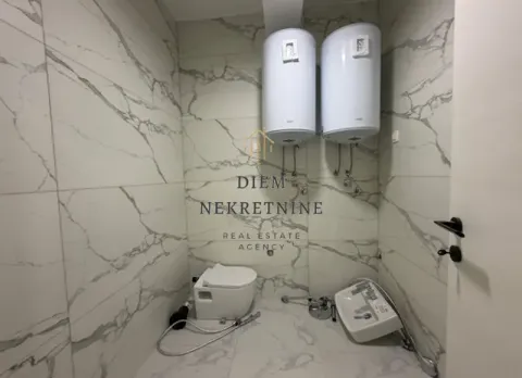 Bathroom under furnishing with sanitaryware and water heaters. - image 10