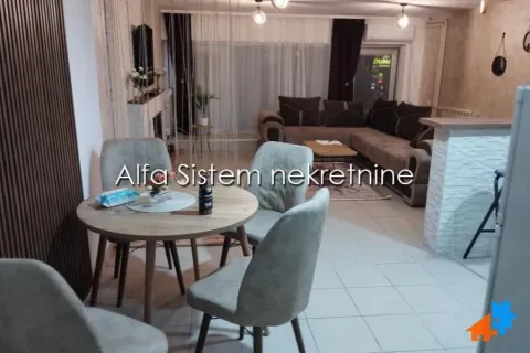 Living room with a dining area and a sofa set. - image 4
