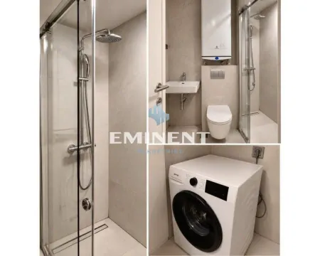 Compact bathroom with a shower cabin, toilet, and washing machine. - image 5