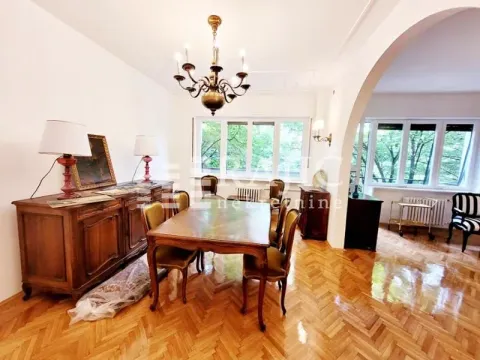 Dining room with a wooden table and chairs. - image 9