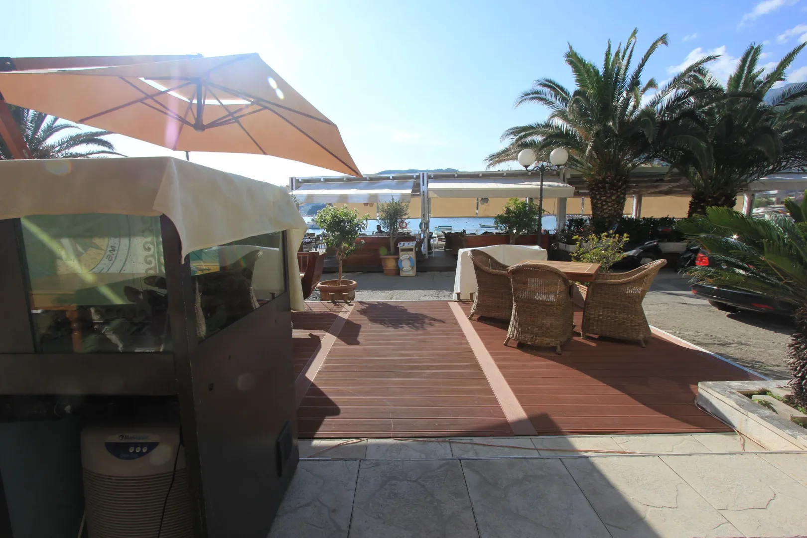 Terrace with outdoor seating furniture and an umbrella.