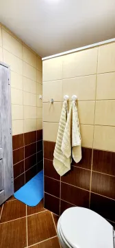 Small bathroom with ceramic tiles and sanitary ware. - image 3