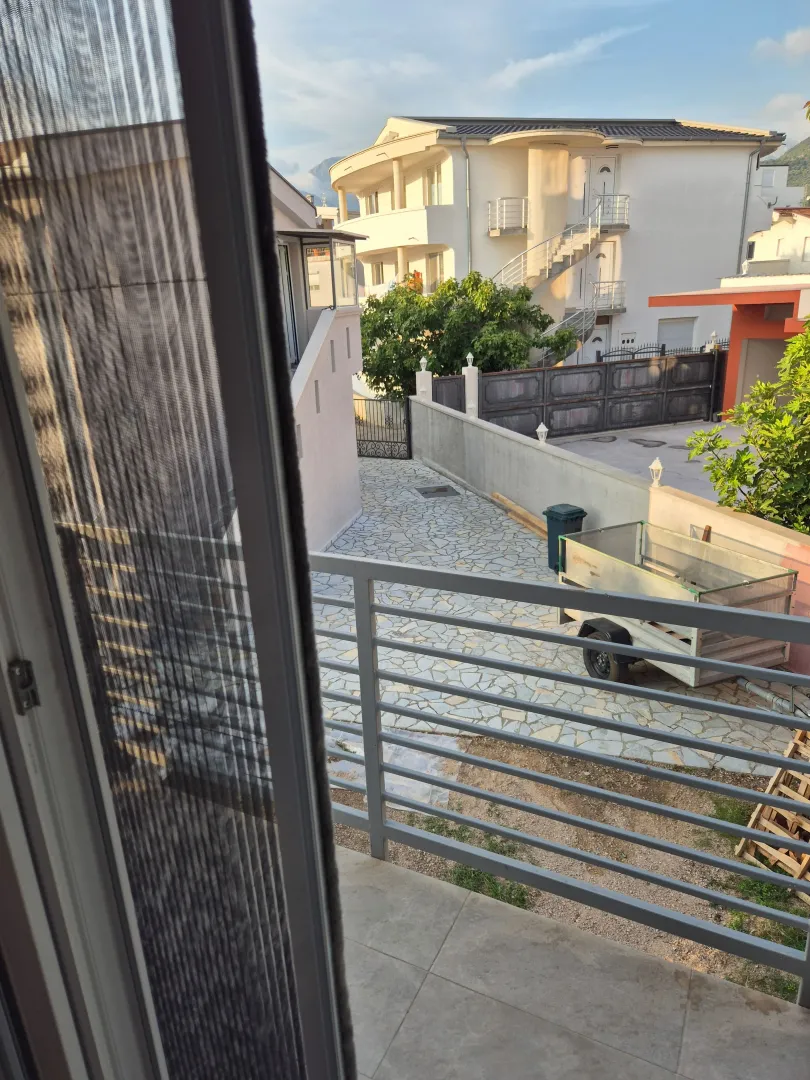 View from the balcony overlooking the yard and neighboring houses.