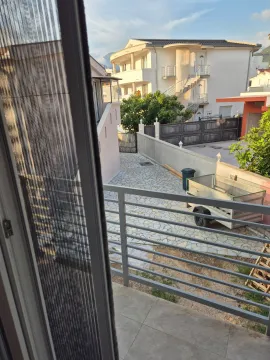 View from the balcony overlooking the yard and neighboring houses. - image 2