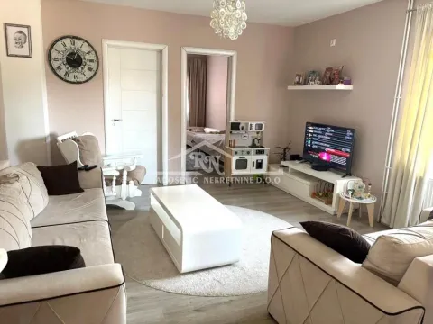Living room with sofa set, coffee table, and TV. - image 15