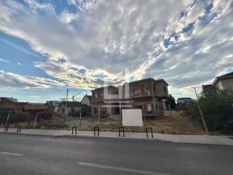 Street view of a house under construction with a yard. - image 2