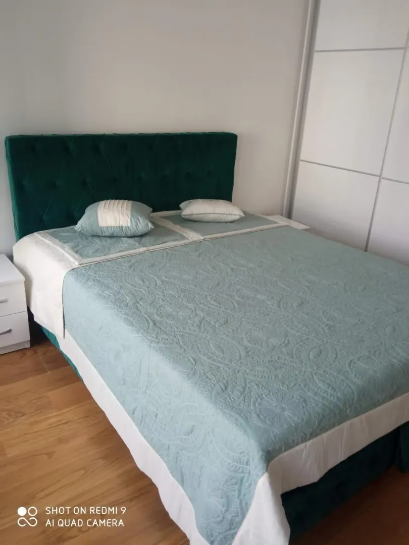 Furnished bedroom with a double bed.