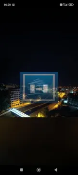 Night view from the window overlooking the illuminated city and surroundings. - image 19