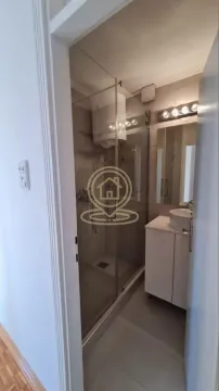 View of a modern bathroom equipped with a walk-in shower. - image 7