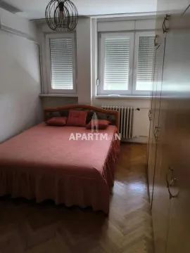 Bedroom with a double bed and a fitted wardrobe. - image 5