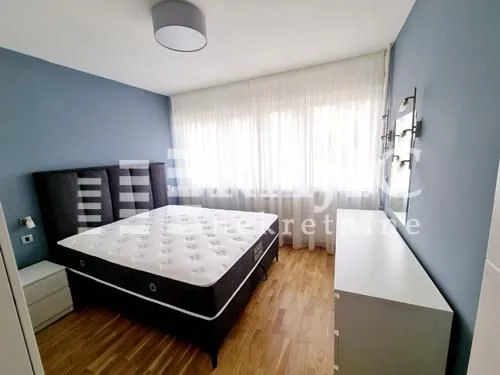 Furnished bedroom with a double bed.