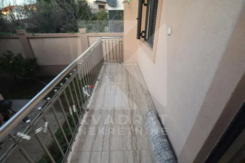 Tiled balcony with metal railing and a view of the yard. - image 22