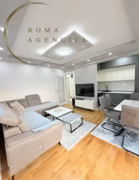 Spacious living room connected to the dining area and kitchen. - image 4