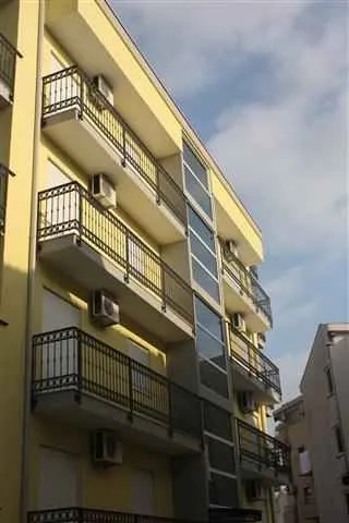 View of the exterior of the residential building with balconies.