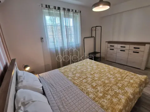 Bedroom with a double bed, window, and dresser. - image 6