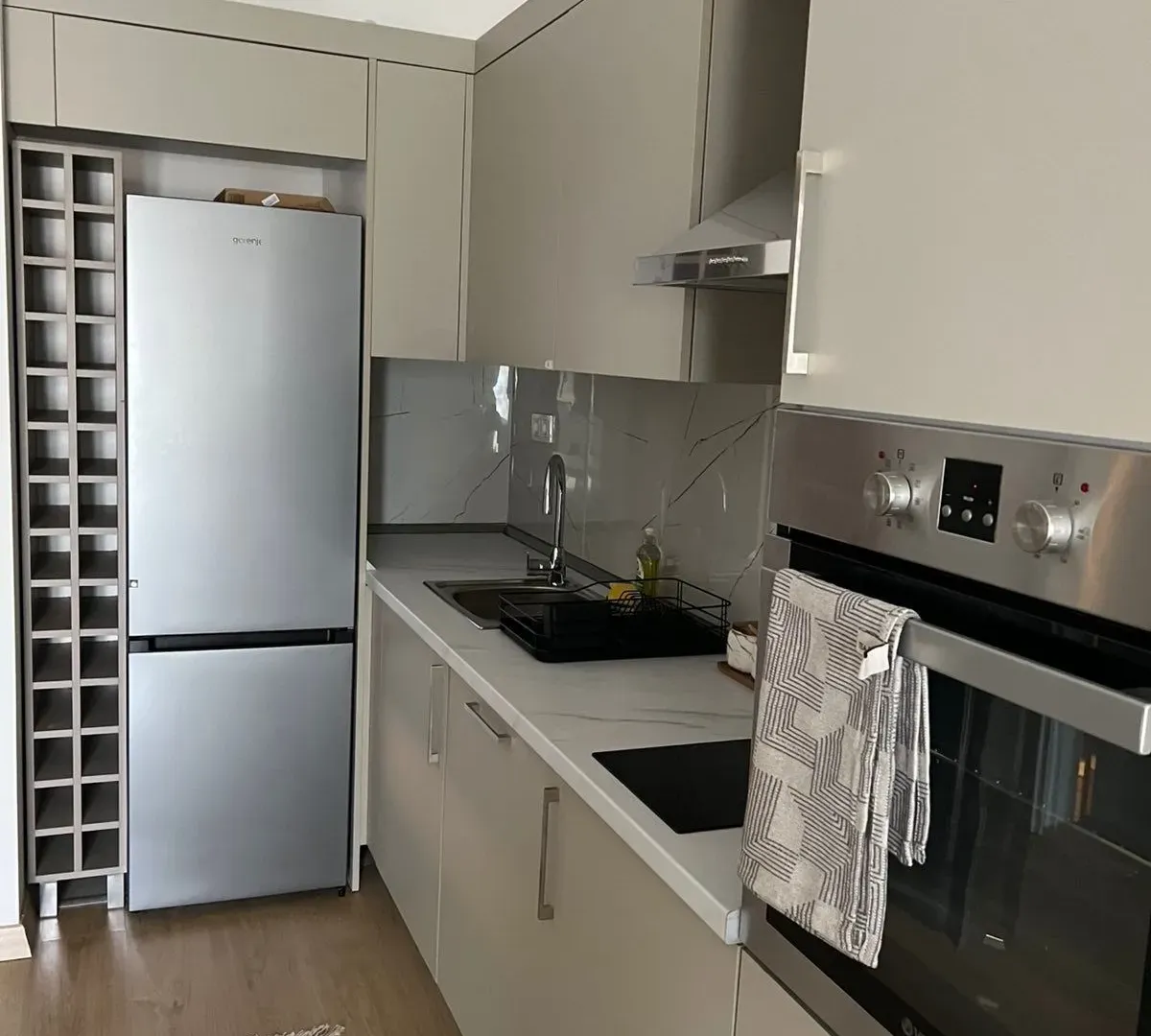 Modern kitchen with built-in cabinetry and appliances.