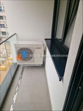 Smaller balcony with an outdoor air conditioning unit. - image 13