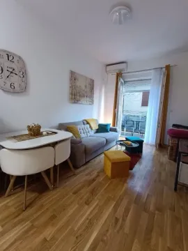 Furnished living room with a dining area and access to the terrace. - image 2