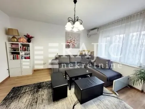 Furnished living room with sofa set and bookshelf. - image 18
