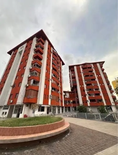 Exterior view of residential buildings with a courtyard.