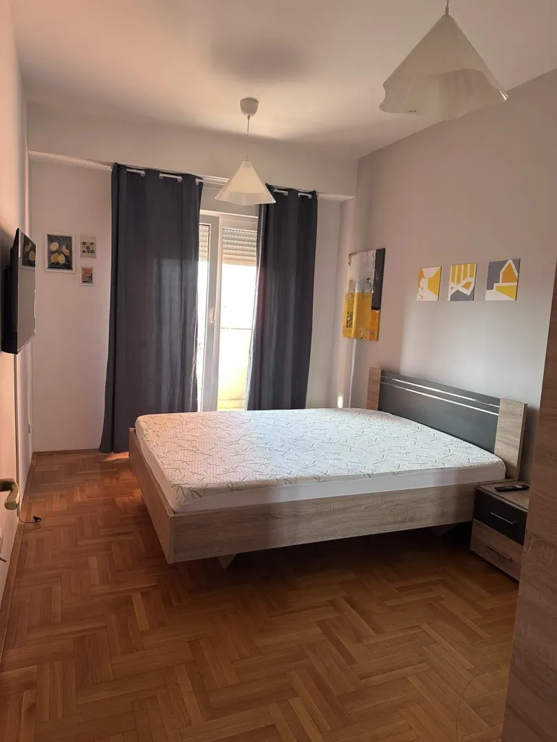 Bright bedroom with a double bed.