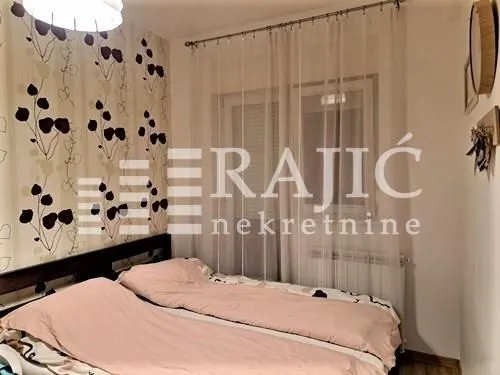 Furnished bedroom with a double bed.